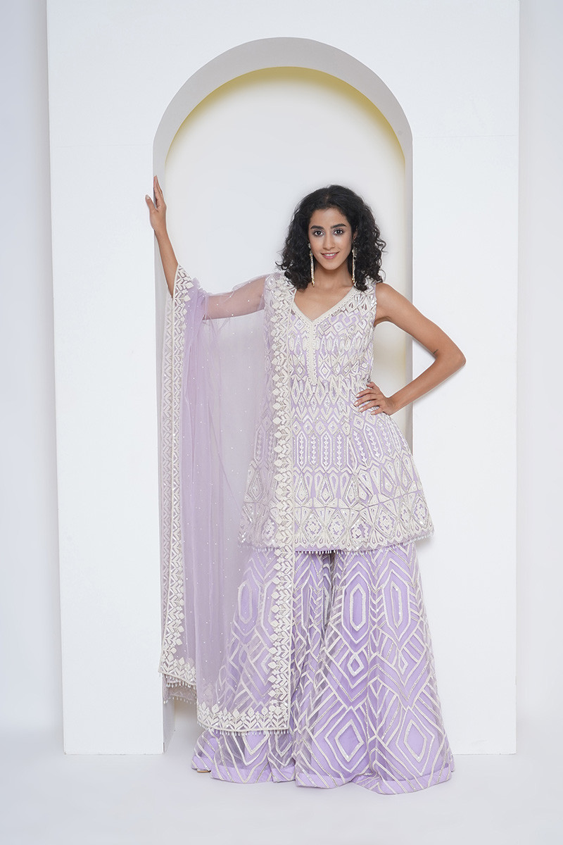 Pastel mauve tulle gharara ensemble, intricately hand embroidered in beads and thread work, worn with tulle . This item can be made to order in colours and  size.